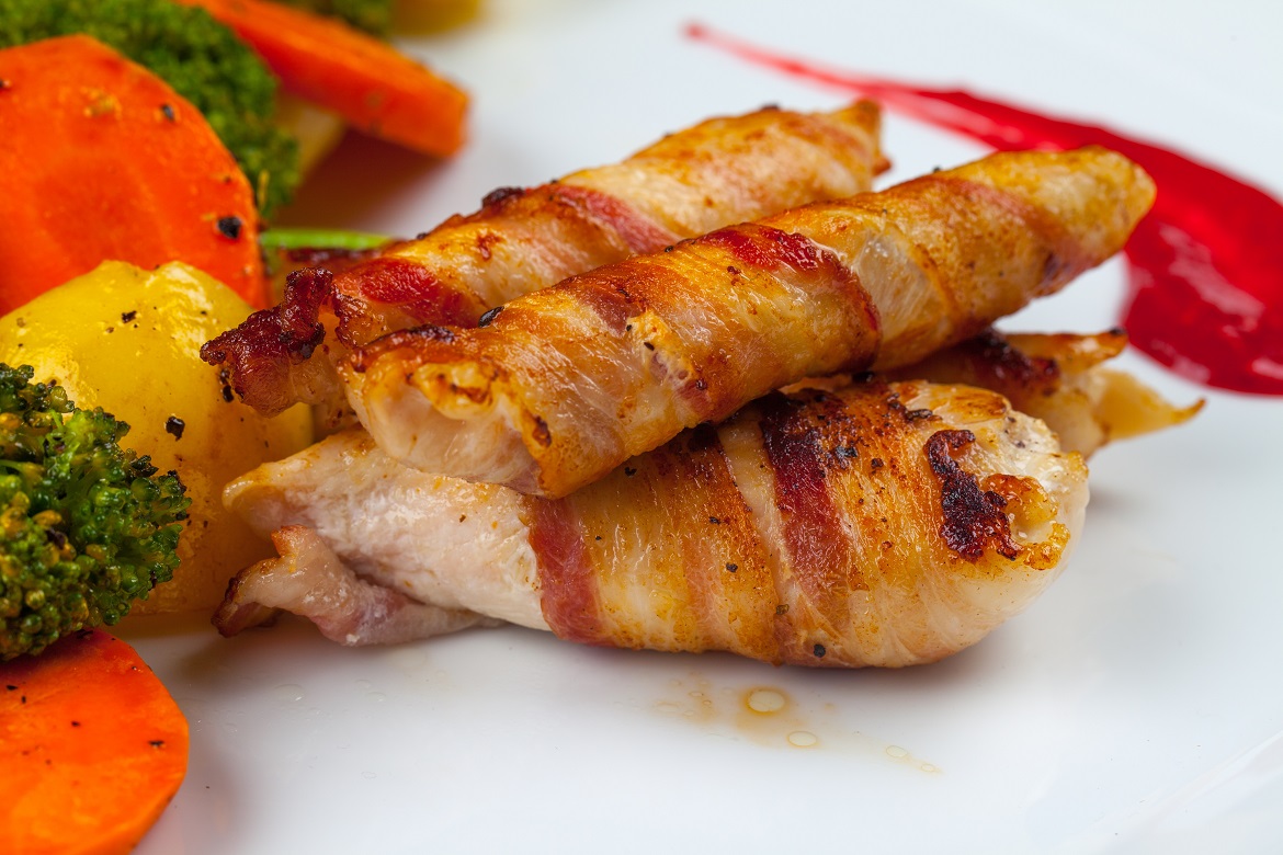 Bacon wrapped chicken fillet with buttered vegetables